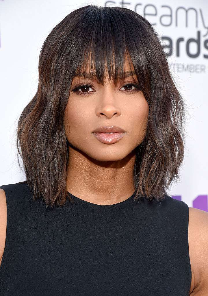 Short textured bob with wispy bangs and light fringe across the forehead