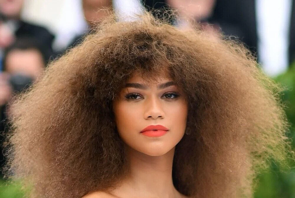 Natural curly hair with soft curly fringe and rounded volume